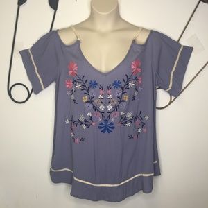 Torrid embroidered cold shoulder pullover.